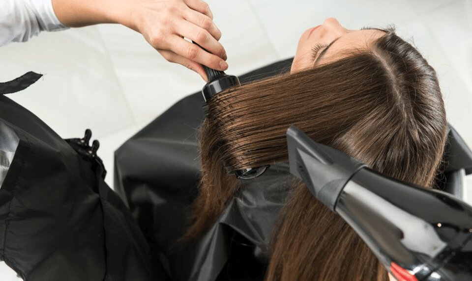 hairdressers blowdrying hair